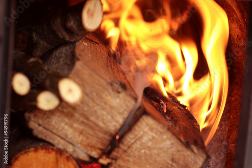Valokuvatapetti firewood burning in the furnace coals
