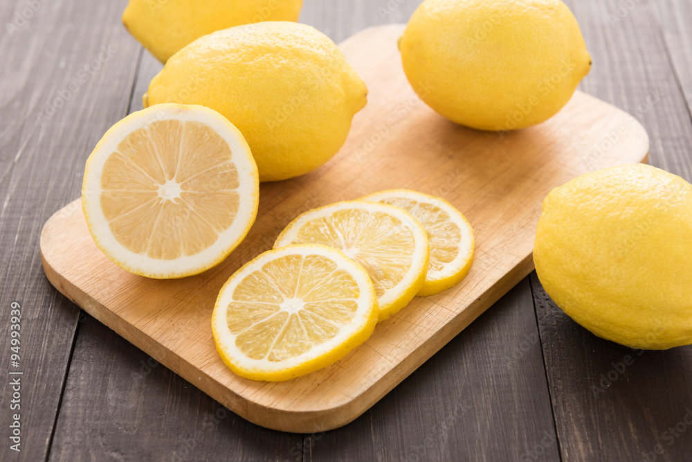 Fresh slice lemon on the wooden table Fresh slice lemon on the wooden table