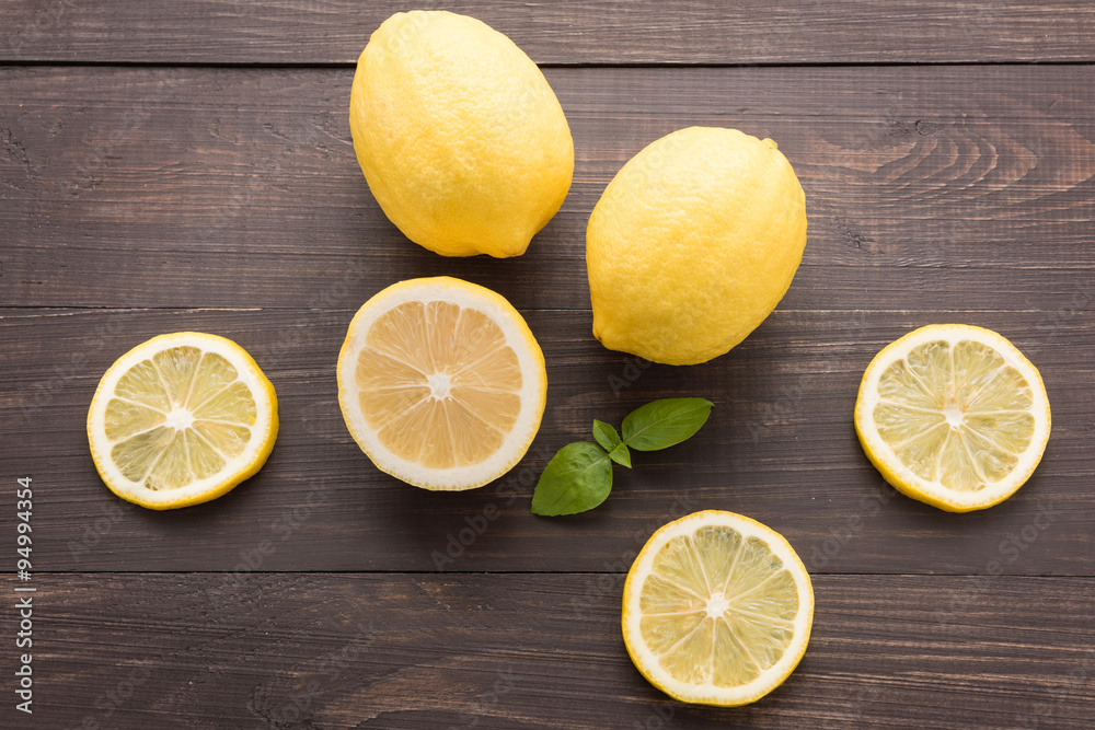 Fresh slice lemon on the wooden background Fresh slice lemon on the wooden background