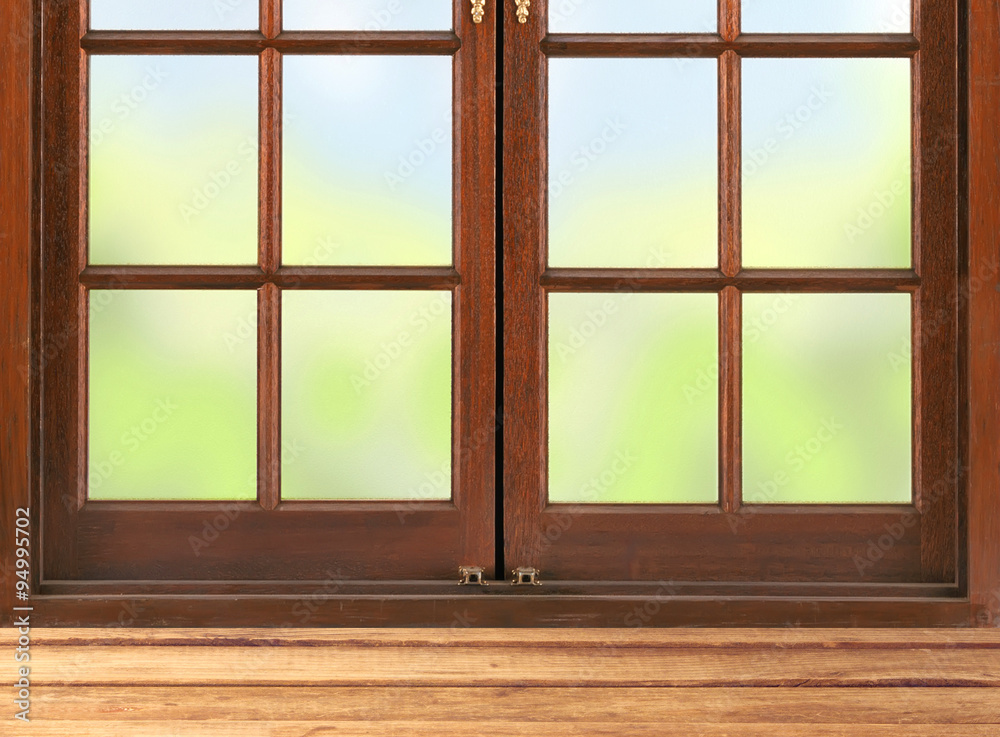 Wooden table and window and nature background