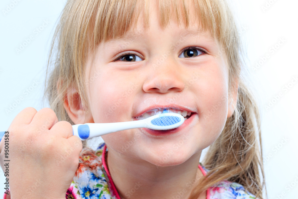 Face shot of youngster brushing teeth. Face shot of youngster brushing teeth.