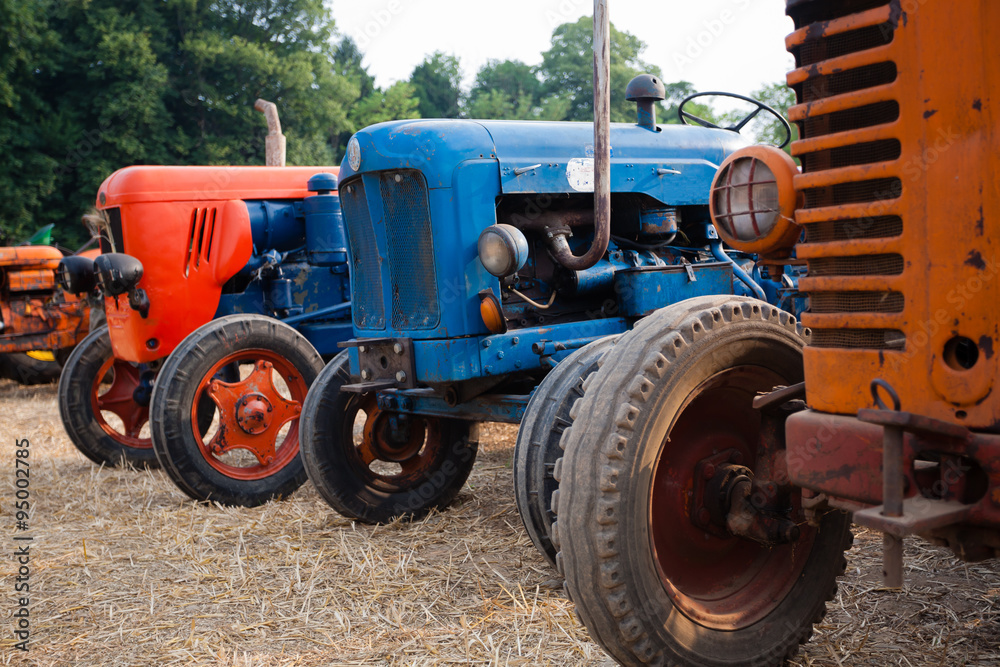 Old tractors in perspective, agricultural vehicle, rural life Old tractors in perspective, agricultural vehicle, rural life