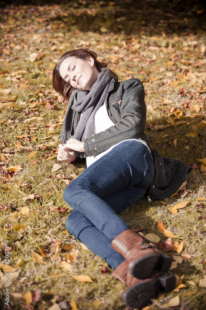 Woman out walking in the autumn sun Woman out walking in the autumn sun