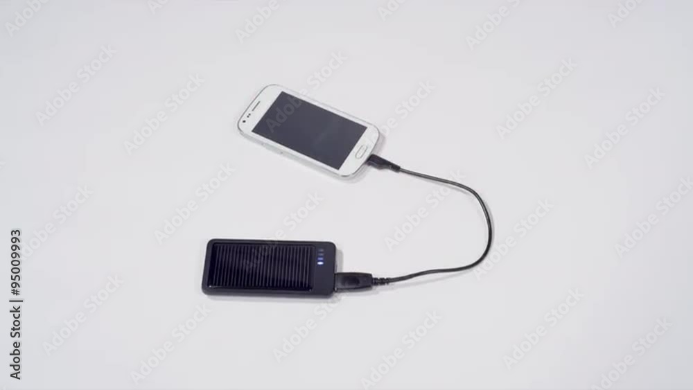 Charging smartphone with solar cell phone charger Charging smartphone with solar cell phone charger