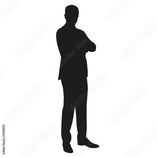 Business main in suit with folded arms