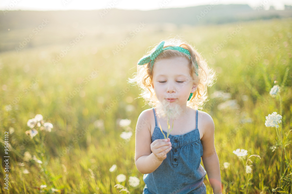 Portrait of a little girl walking in the field Portrait of a little girl walking in the field
