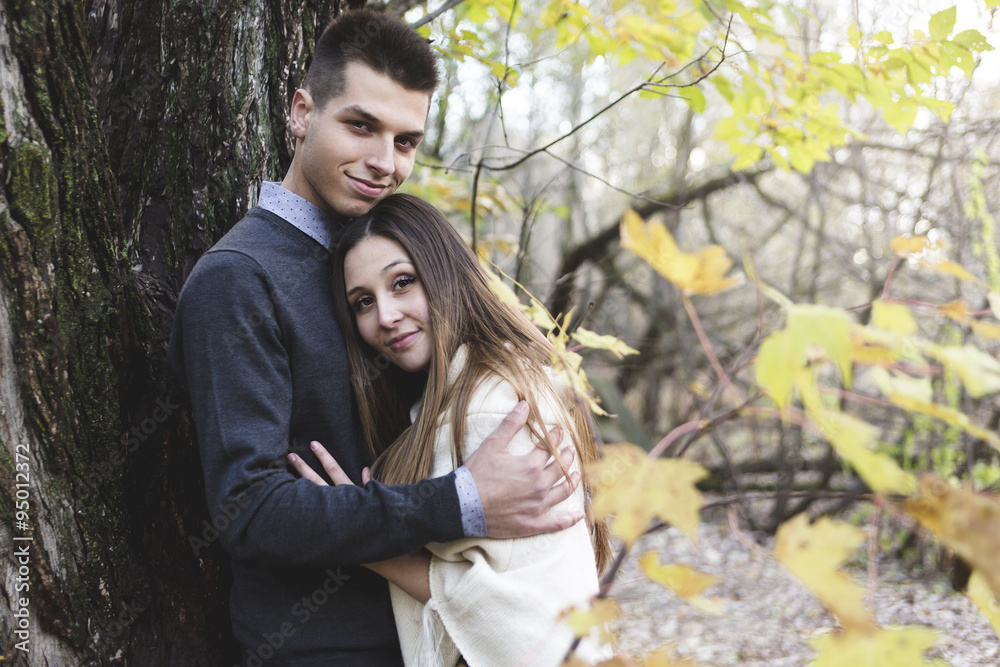 Teen couple at autumn park Teen couple at autumn park