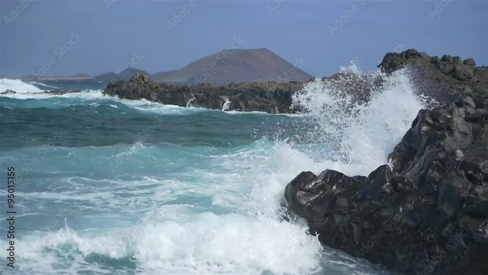 SLOW MOTION: Rough sea splashing into the rocks SLOW MOTION: Rough sea splashing into the rocks
