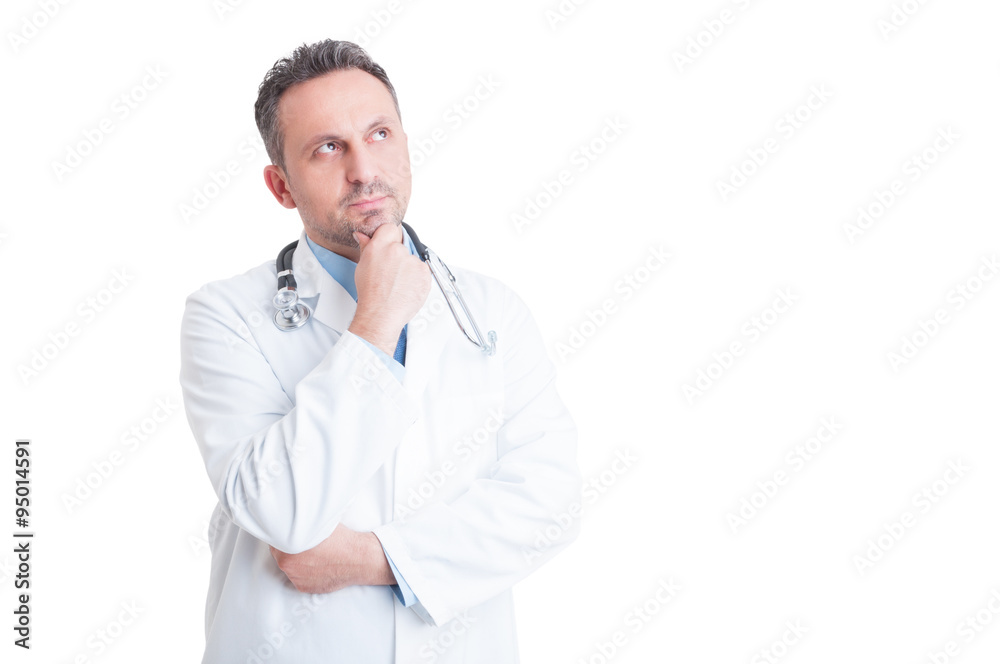 Smart and handsome doctor or medic thinking and wondering Smart and handsome doctor or medic thinking and wondering
