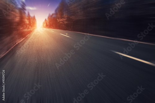 Road in forest with motion blur