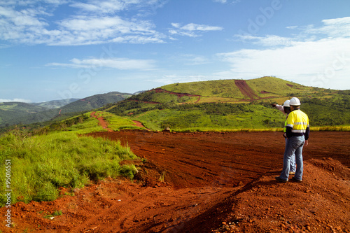 Mining construction workers on mountain top in Sierra Leone 