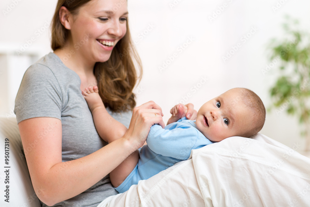 mother with her small baby in nursery room