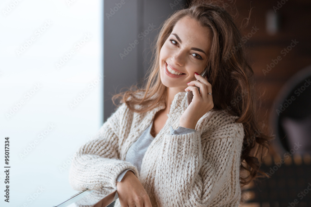 Fototapeta premium Woman talking on the phone