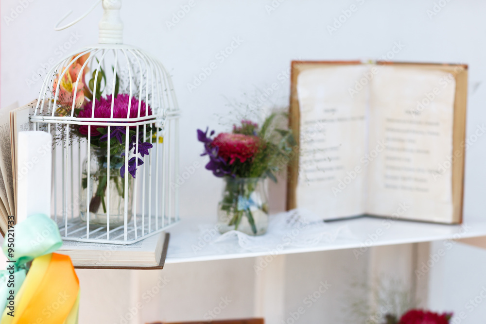 excellent good vintage decor with white flowers and cage book