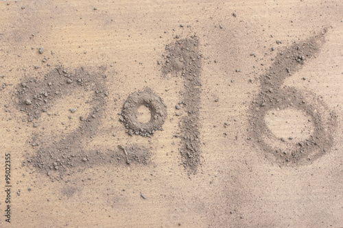 2016 made by soil on wood background.