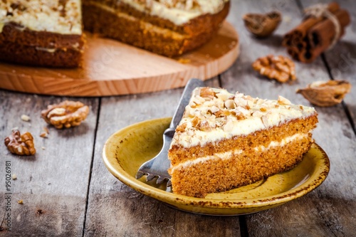 Piece of homemade carrot cake with walnuts