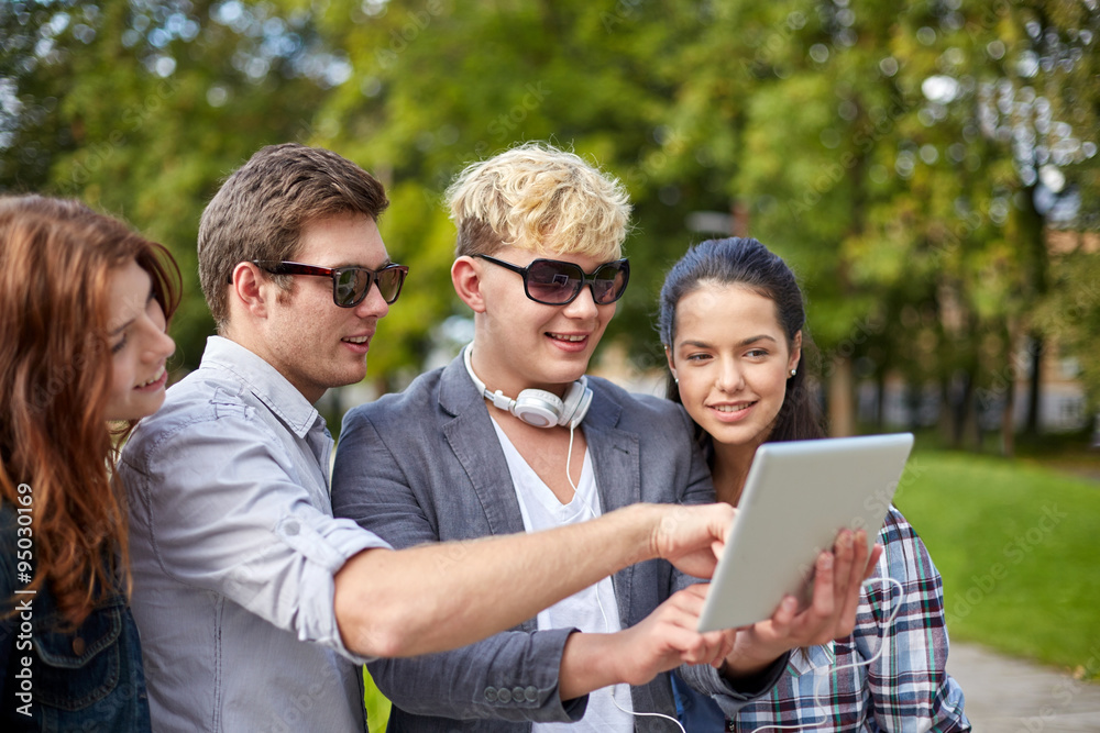students or teenagers with tablet pc taking selfie students or teenagers with tablet pc taking selfie