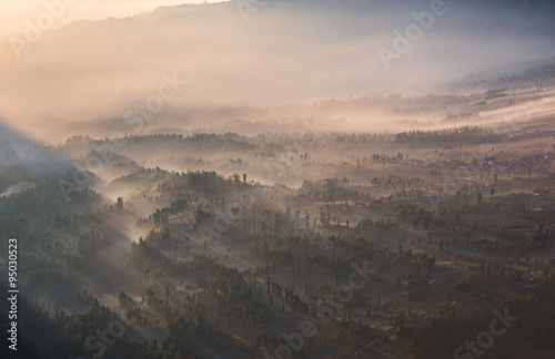 Cemoro Lawang; small village in morning mist. Which situated on the edge of massive north-east of Mount Bromo, East Java, Indonesia photo