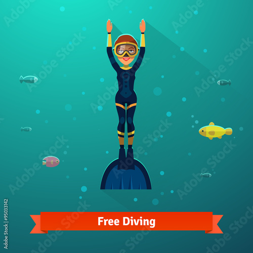 Surfacing free diver woman in wetsuit