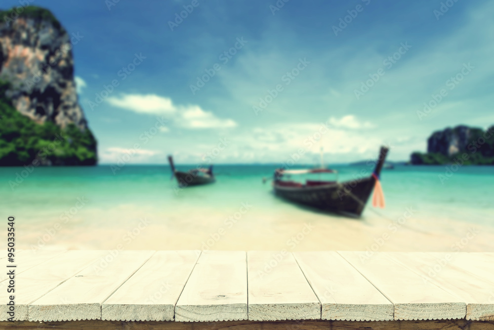 Fototapeta premium Empty top of wooden table or counter and view of tropical beach