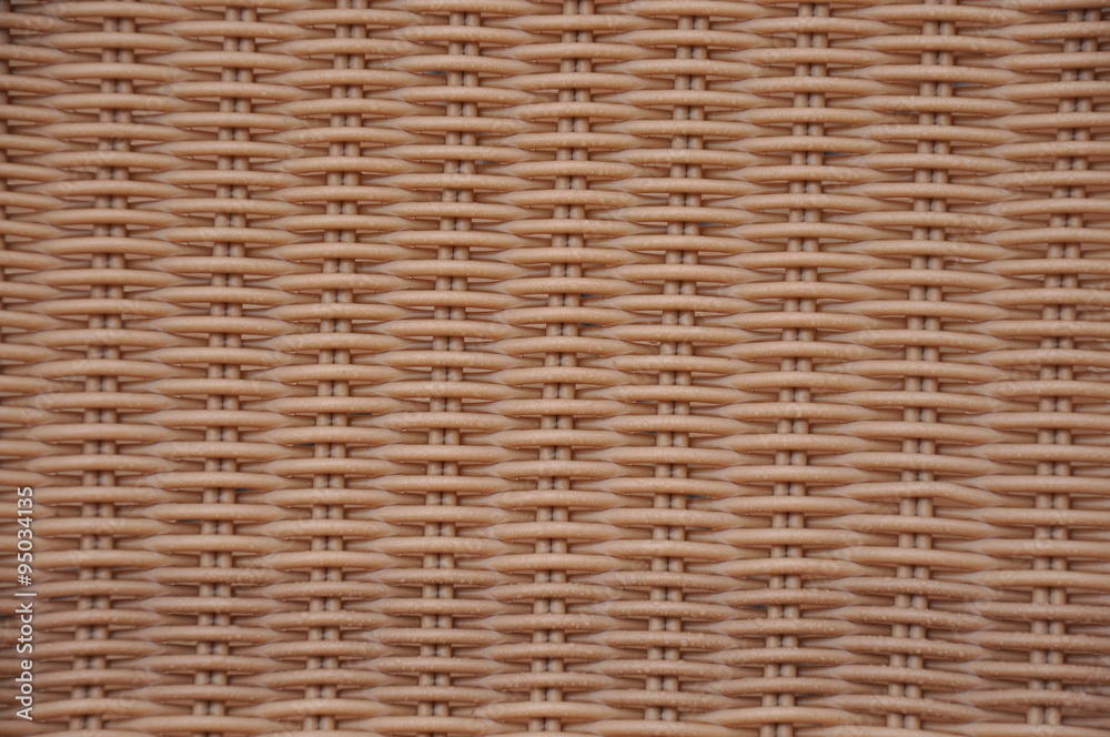 A plastic chair brown basket weave pattern, for background A plastic chair brown basket weave pattern, for background