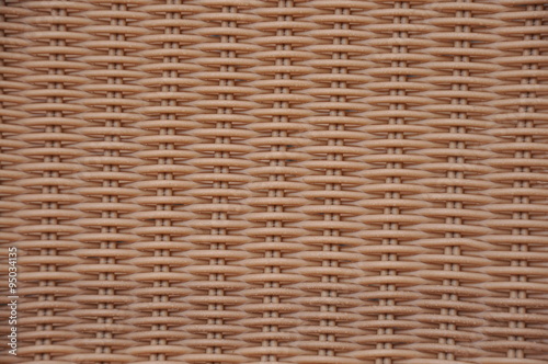 A plastic chair brown basket weave pattern, for background