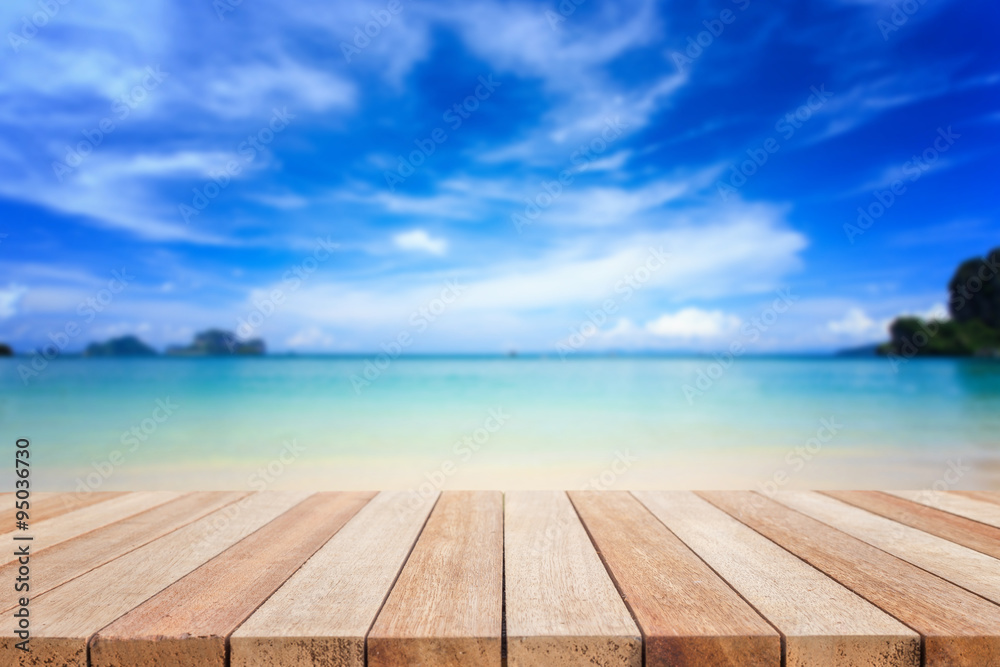 Fototapeta premium Empty top of wooden table or counter and view of tropical beach