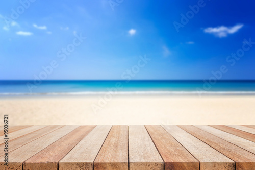 Empty top of wooden table or counter and view of tropical beach