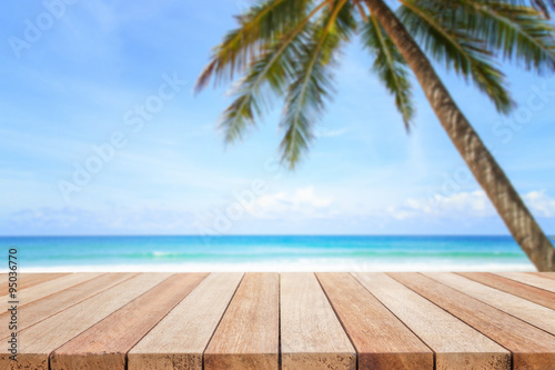 Empty top of wooden table or counter and view of tropical beach © SKT Studio