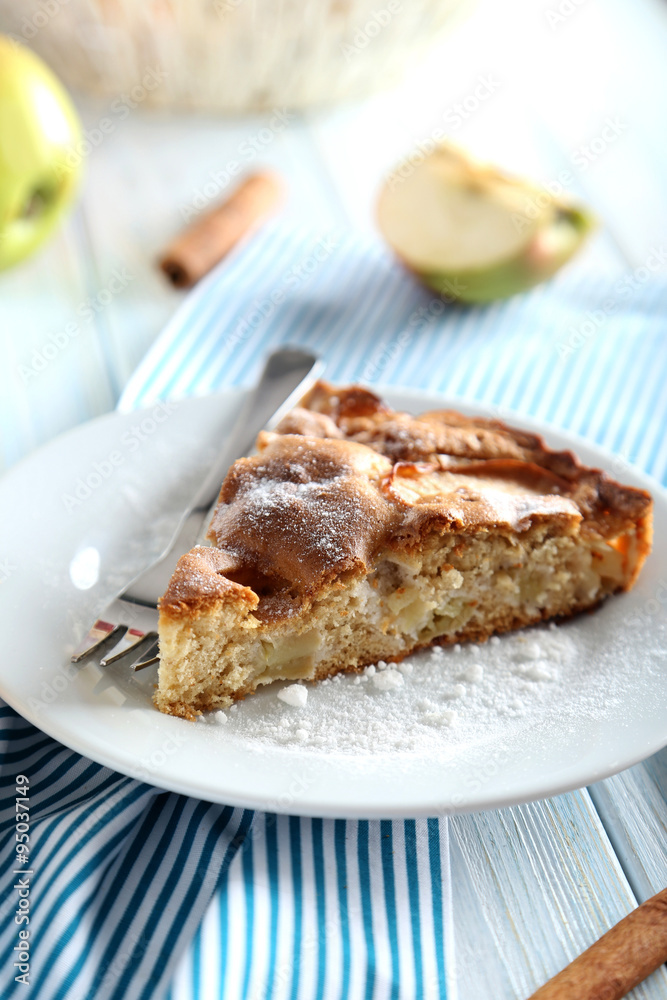 Homemade apple cake on blue wooden table