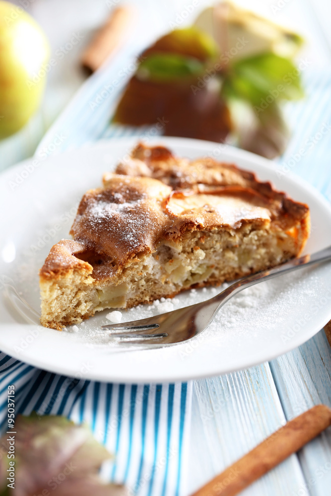 Homemade apple cake on blue wooden table