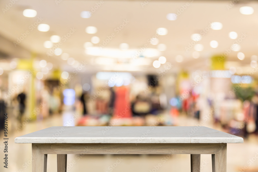 Empty top of natural stone table and blur with bokeh background Empty top of natural stone table and blur with bokeh background