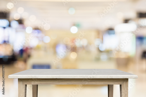 Empty top of natural stone table and blur with bokeh background