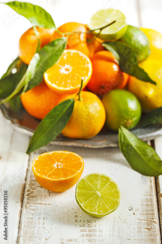 Fresh citrus fruits with leaves
