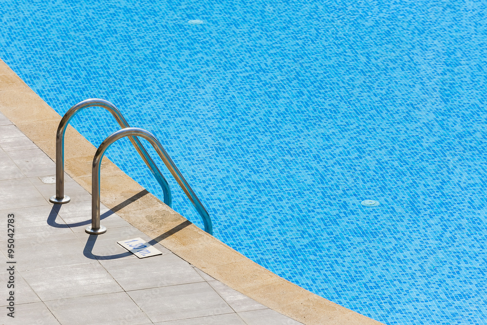 Edge of swimming pool. Barriers to exit the pool.