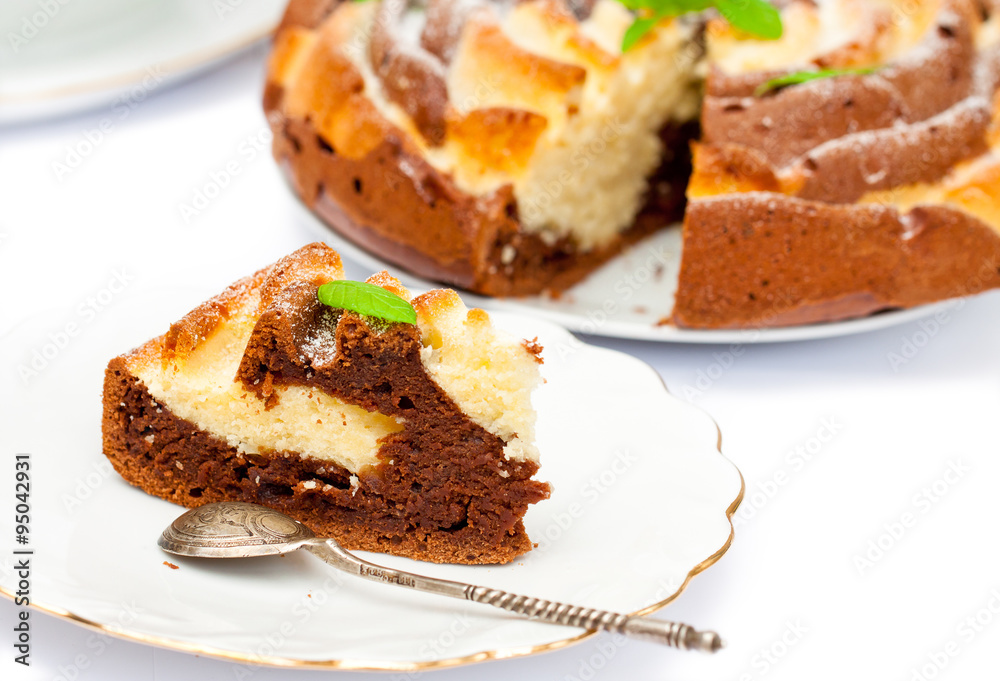 Isolated two-tone homemade color cake with mint leaves Isolated two-tone homemade color cake with mint leaves