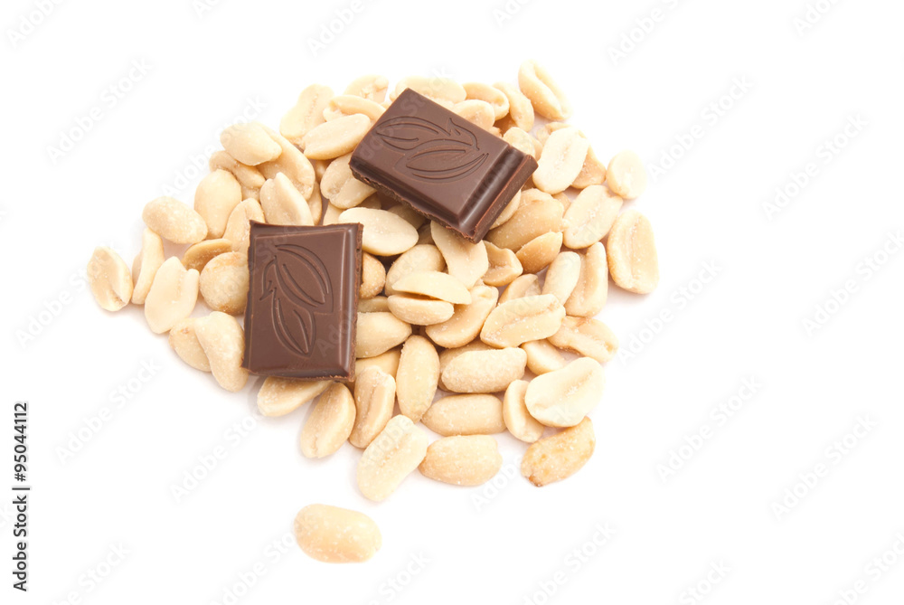 Fototapeta premium chocolate bar and peanuts on white