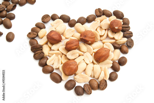 coffee beans, peanuts and hazelnuts on white