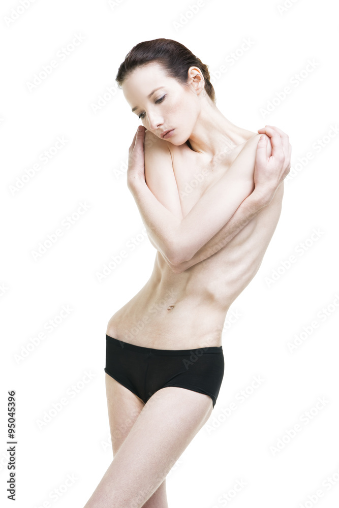 Fototapeta premium Young woman suffering from anorexia