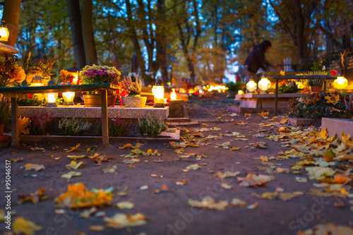 Vászonkép Colorful candles on the cemetery at All Saints Day, Poland