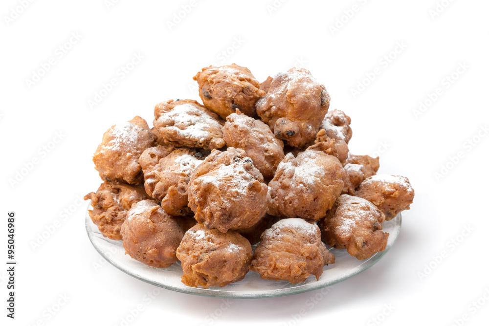 Heap of sugared fried fritters or oliebollen on scale Heap of sugared fried fritters or oliebollen on scale