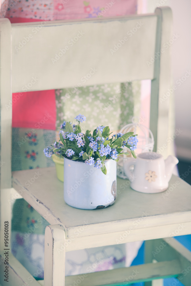 Fototapeta premium Forget-me-not in rustic cup 