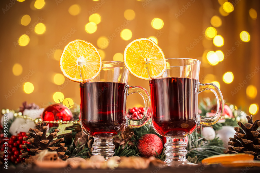 Christmas hot mulled wine with spices on a wooden table. The idea for creating greeting cards Christmas hot mulled wine with spices on a wooden table. The idea for creating greeting cards