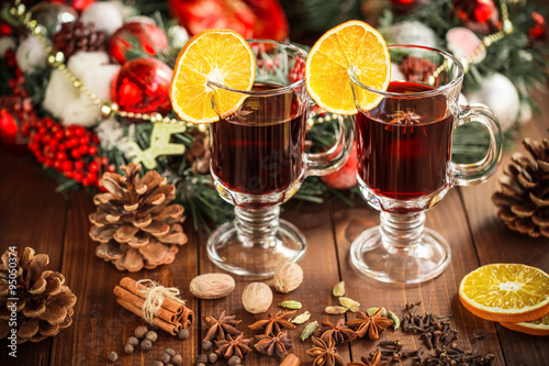 Christmas hot mulled wine with spices on a wooden table. The idea for creating greeting cards © Ievgenii Meyer