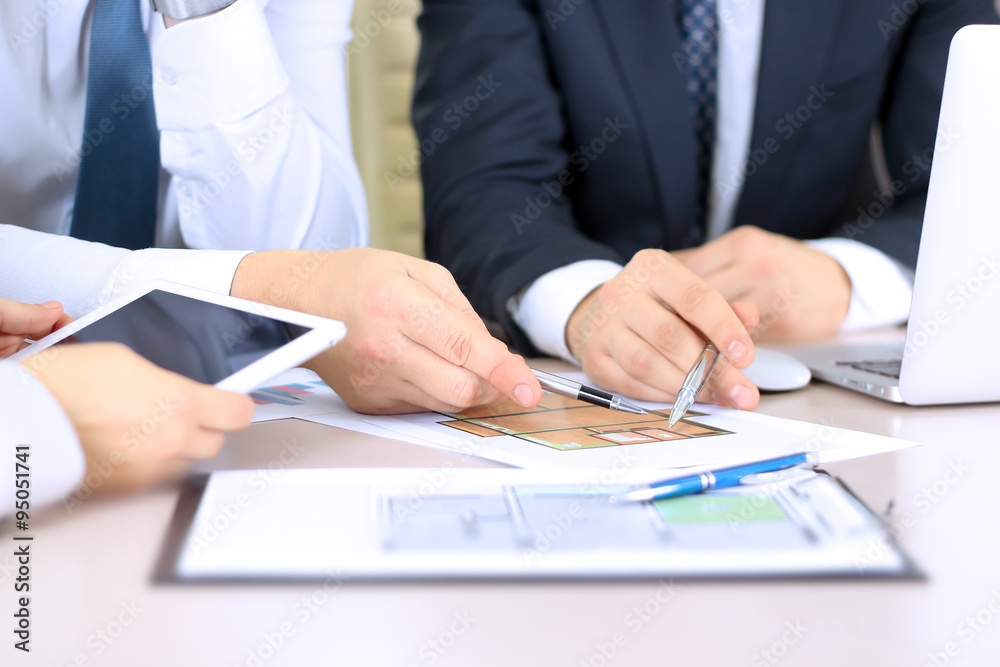 Real-estate agent discussing a house plans with a businessman. Real-estate agent discussing a house plans with a businessman.