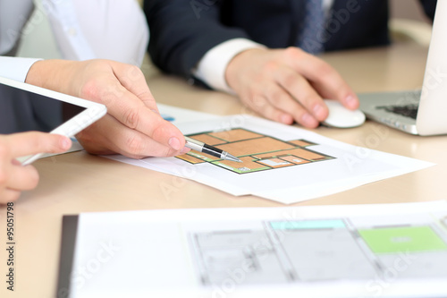 Wallpaper Mural Real-estate agent discussing a  house plans with  a businessman. Torontodigital.ca