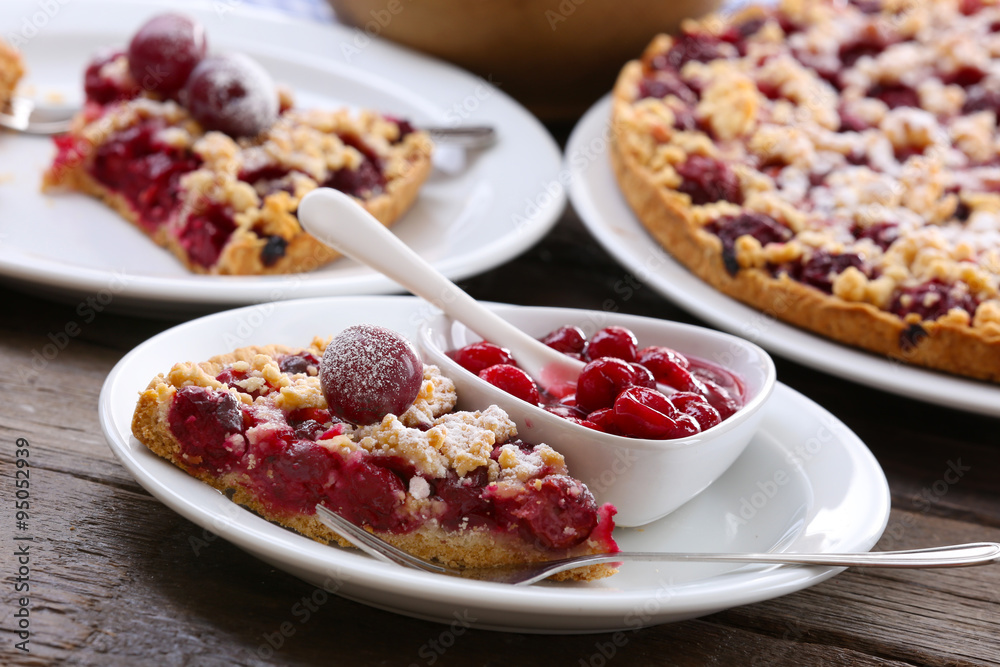 Tasty homemade pie with cherries on table close up Tasty homemade pie with cherries on table close up