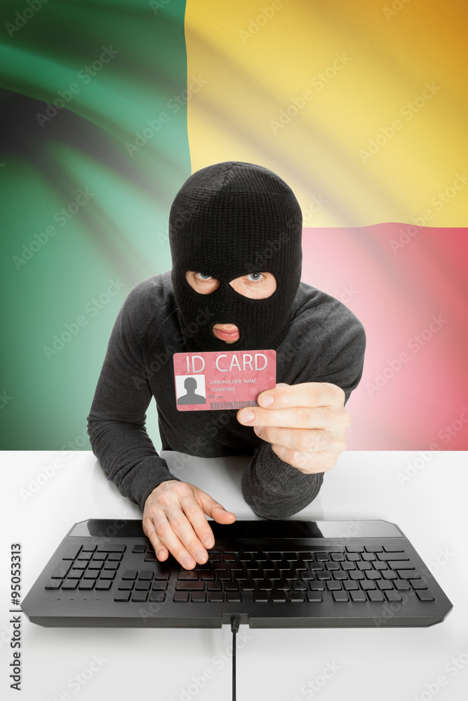 Hacker with flag on background holding ID card in hand - Benin Hacker with flag on background holding ID card in hand - Benin