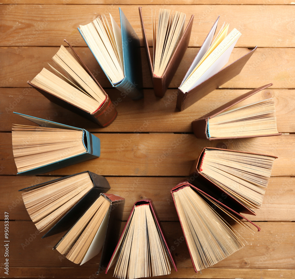 Heart of books, on wooden background Heart of books, on wooden background