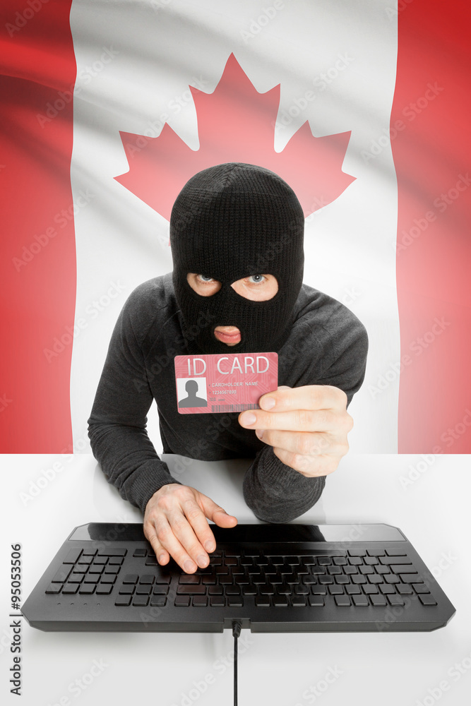 Hacker with flag on background holding ID card in hand - Canada